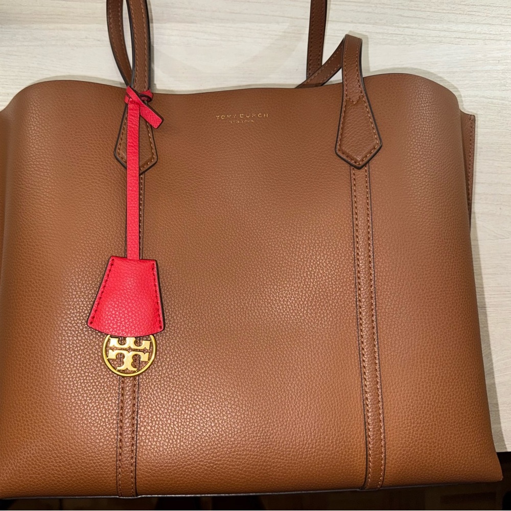 Tory Burch Cognac Leather Tote with Red Charm